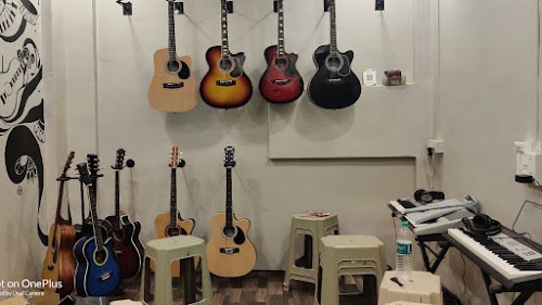 THE ULTIMATES MUSIC ACADEMY AND GUITAR SHOP